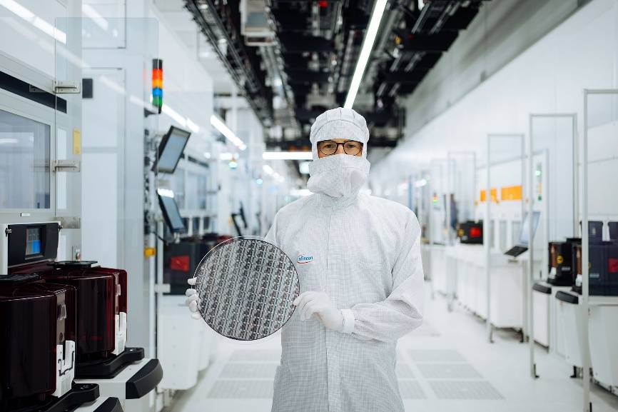 A person in a white protective suit holding a circle AI-generated content may be incorrect.